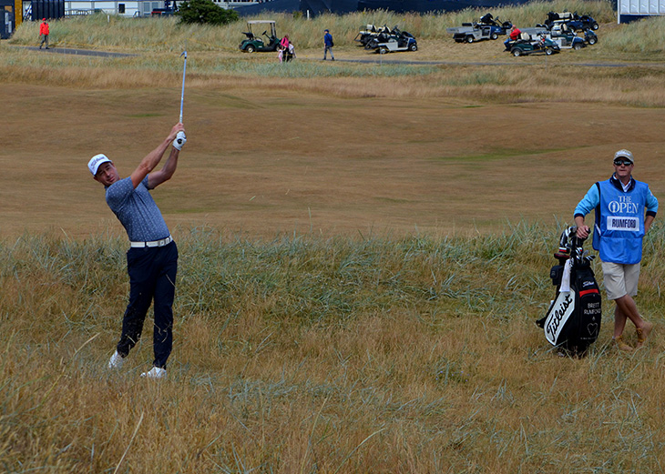 After his tee shot ran into the right rough, Brett...