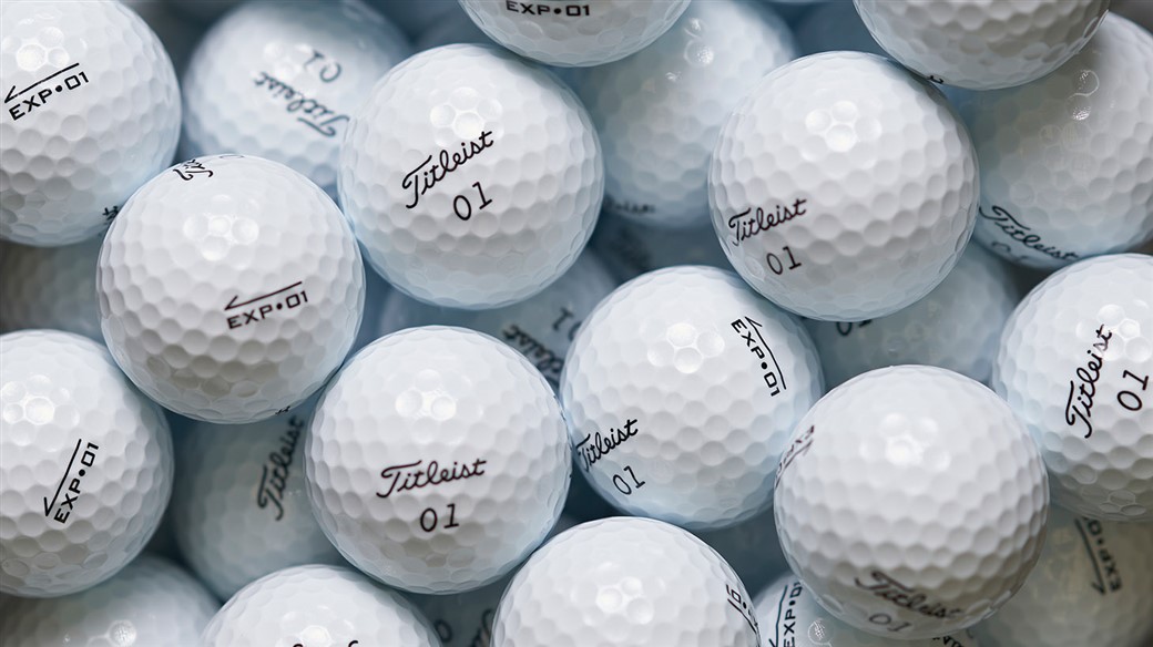 Photo of multiple EXP•01 golf balls, ready for packaging.