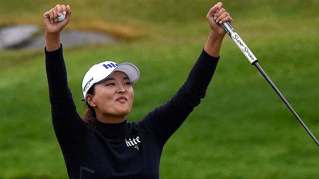 Jin Young Ko raises her arms in triumph after holing the winning putt at the 2019 Evian Championship