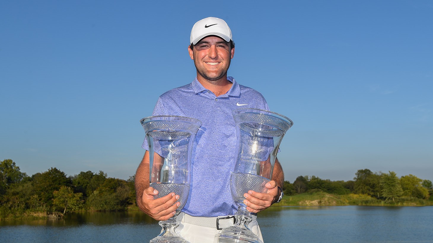 Scottie Scheffler celebrates with two trophies as Finals points leader and Regular Season points leader on the 2019 Korn Ferry Tour