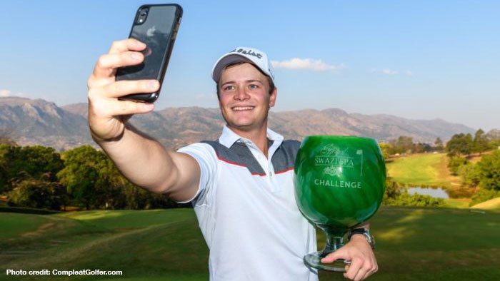 Ruan Conradie takes a selfie with trophy from maiden victory.